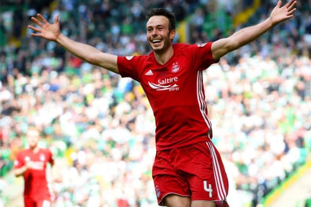 Andrew Considine celebrates putting the away side ahead. Picture: SNS