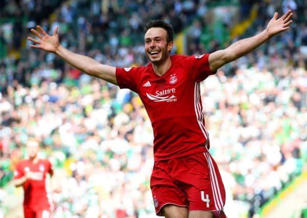 Andrew Considine celebrates putting the away side ahead. Picture: SNS