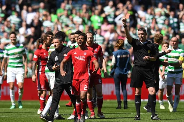 Aberdeen's Shay Logan is sent off after the final whistle by referee Craig Thomson. Picture: SNS