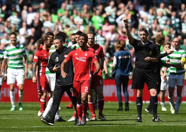 Aberdeen's Shay Logan is sent off after the final whistle by referee Craig Thomson. Picture: SNS