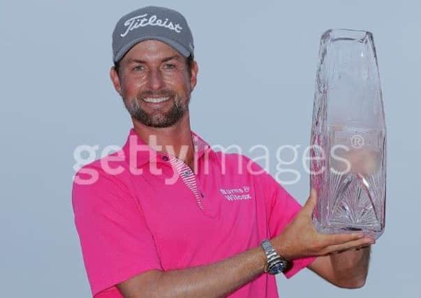 Webb Simpson holds aloft the Players Championship trophy after his four-shot success at Sawgrass. Picture: Getty Images