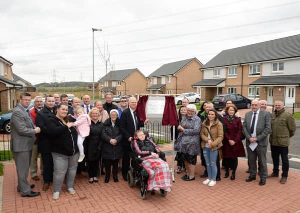 North Lanarkshire provost Jean Jones officially opens the new development in Cardowan Drive, joined by tenants, elected members and officers from North Lanarkshire Council and developer Lovell Partnership Ltd.