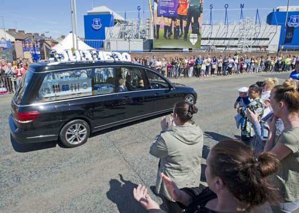 The funeral cortege of Alfie Evans goes past Everton's Goodison Park ground. Picture: PA