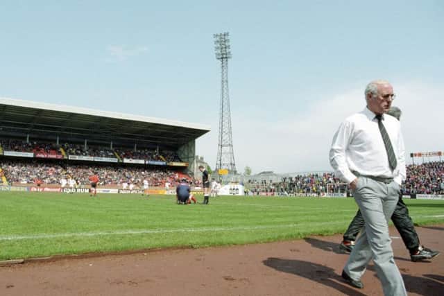 Jim McLean returns to his seat in the dugout as Dundee United lose 4-1 to Aberdeen  in 1993  - his last game in charge of the Tannadice club.
