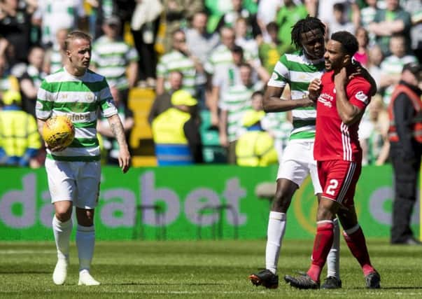 Leigh Griffiths, left, and Dedryck Boyata were both guilty of throwing the ball at Aberdeen's Shay Logan. Picture: SNS