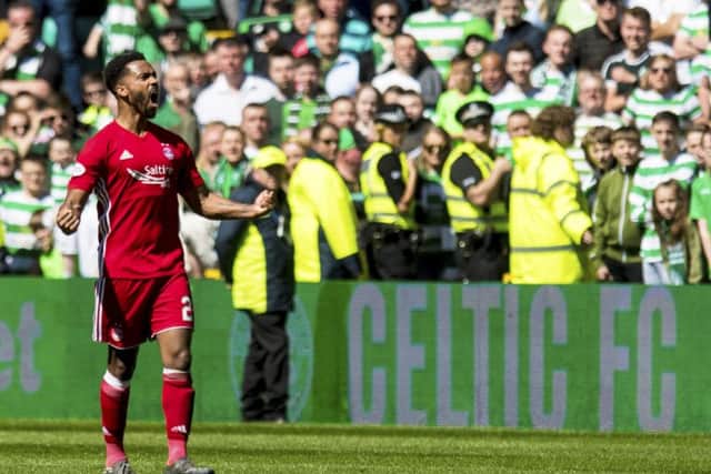 Shay Logan goads the Celtic fans as he leaves the field. Picture: SNS