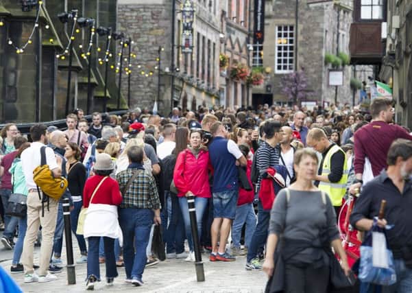 03/08/2017.  Tourists on the Royal Mile/High Street, Edinburgh during the 2017 Edinburgh International Festival.