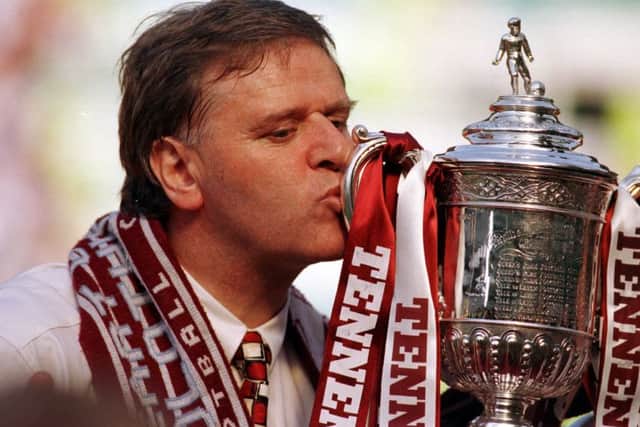 A dream come true - Jim Jefferies kisses the Scottish Cup after his Hearts side had overcome Rangers 2-1 at Celtic Park. Picture: Julie Bull.