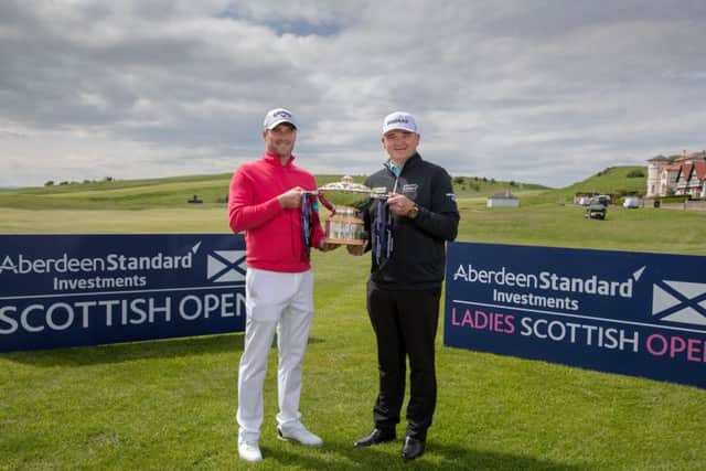 Marc Warren and Paul Lawrie with the Scottish Open Trophy at Gullane. Picture: Kenny Smith.