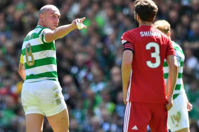 Scott Brown and Graeme Shinnie clashed at Celtic Park. Picture: SNS