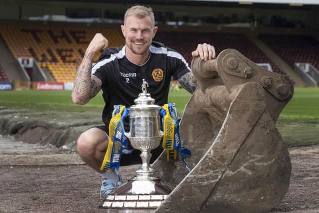Motherwell's Richard Tait
with the Scottish Cup. Picture: Steve Welsh