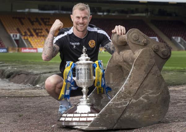 Motherwell's Richard Tait
 with the Scottish Cup. Picture: Steve Welsh