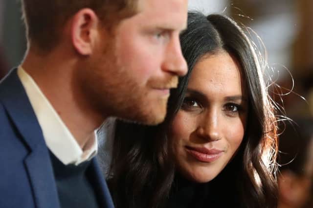 Britain's Prince Harry (L) and his fiancÃ©e US actress Meghan Markle. Picture: Getty Images