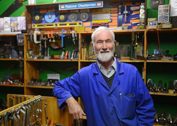 Val Pearson with his collection of thousands of historic tools that he has collected over the years.  Picture: SWNS