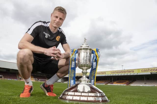 Motherwell midfielder Andy Rose with the Scottish Cup at Fir Park. Picture: Steve Welsh
