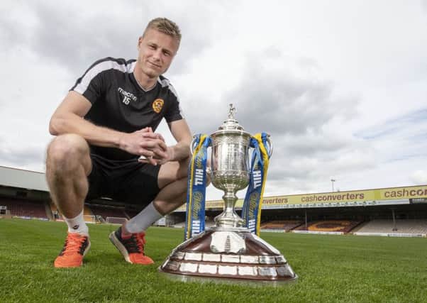 Motherwell midfielder Andy Rose with the Scottish Cup at Fir Park. Picture: Steve Welsh