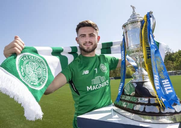 Celtic winger Patrick Roberts
 poses with the William Hill Scottish Cup. Picture: Steve Welsh