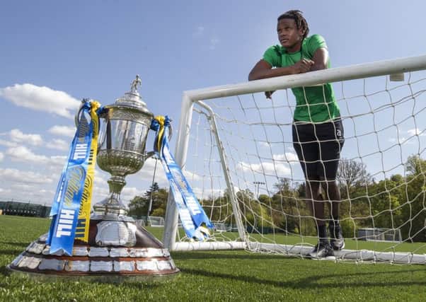 Dedryck Boyata

 with the Scottish Cup at Celtic's training complex at Lennoxtown.