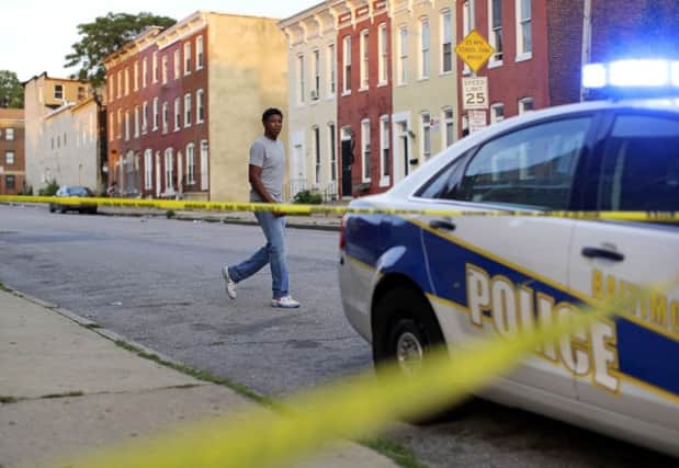 With the police considered ineffectual, a grassroots campaign aims to reduce the tragic rate of homicides in Baltimore (Picture: AP Photo/Patrick Semansky, File)