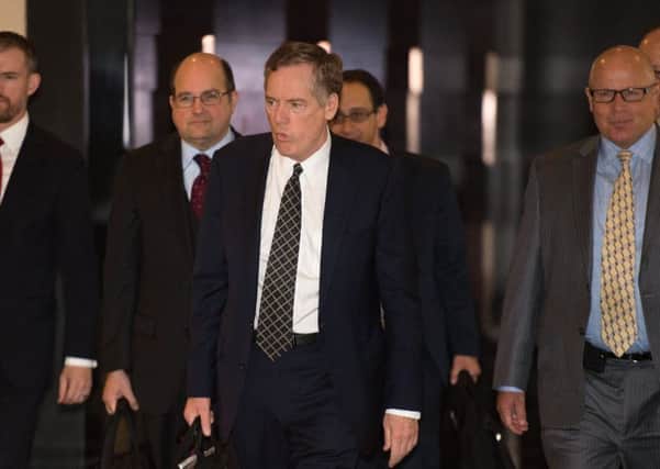United States trade representative Robert Lighthizer,second from left, on his way to meet Chinese officials in Beijing earlier this month. Picture: Getty
