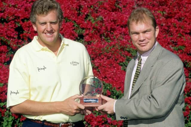 Guy Kinnings, who has been appointed as deputy CEO of the European Tour, presents Colin Montgomerie with his 1996 European Tour Player of the Year award. Picture: Getty.