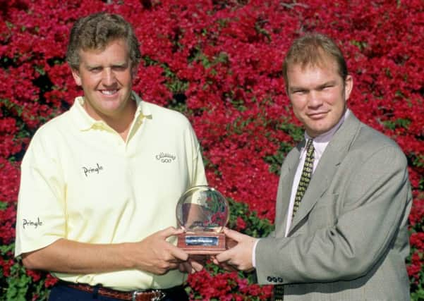 Guy Kinnings, who has been appointed as deputy CEO of the European Tour, presents Colin Montgomerie with his 1996 European Tour Player of the Year award. Picture: Getty.