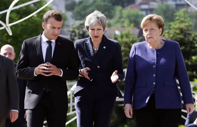 Theresa May with President Macron of France and Chancellor Merkel of Germany. Picture: AFP/Getty Images