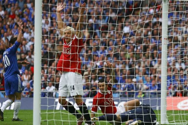 Ryan Giggs, grounded, believes he has scored against Chelsea in the 2007 FA Cup final, but the ball was ruled not to have crossed the line. Picture: Getty.