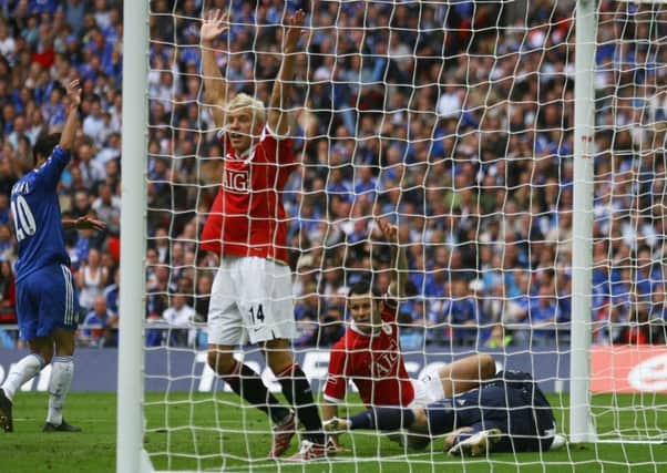 Ryan Giggs, grounded, believes he has scored against Chelsea in the 2007 FA Cup final, but the ball was ruled not to have crossed the line. Picture: Getty.