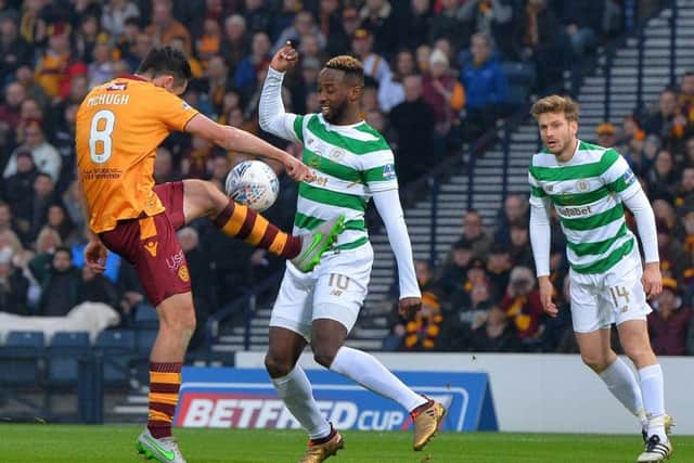 Celtic striker Moussa Dembele is tackled by Carl McHugh of Motherwell during the League Cup final at Hampden in November. Picture: Getty.