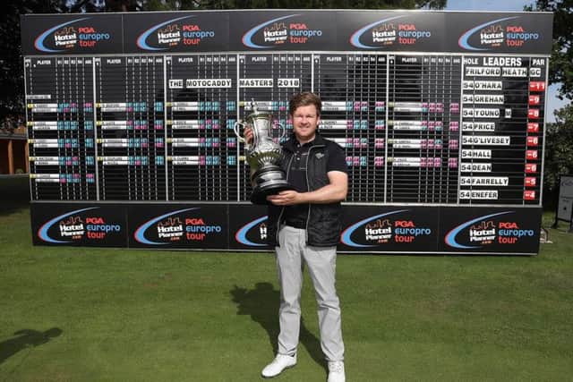 Paul O'Hara shows off the Motocaddy Masters trophy after his win at Frilford Heath