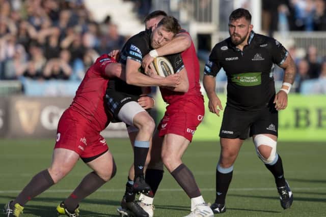 Finn Russell finds his path blocked by the Scarlets defence. Picture: SNS/SRU.