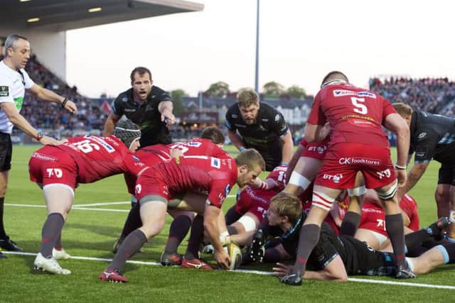 Jonny Gray thinks hes scored  but the try was disallowed as the ball hadnt come out of the ruck. Picture: SNS.