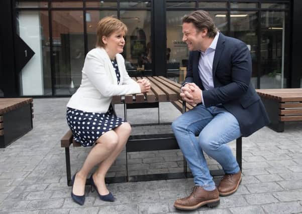 Nicola Sturgeon meets Jamie Oliver at his HQ in London, where she announced new childhood obesity initiatives. Picture: Stefan Rousseau/PA