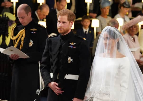 Prince Harry looked visibly emotional when he saw his bride arrive at the altar. Picture: PA Wire