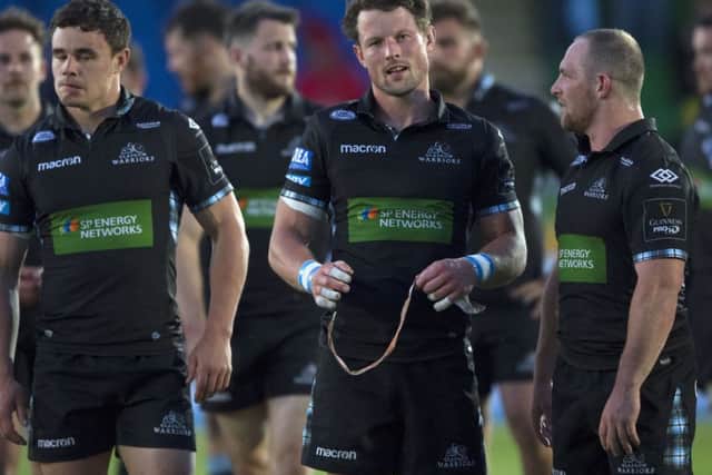 Peter Horne is dejected at full-time following Glasgows defeat by Scarlets. Picture: SNS/SRU