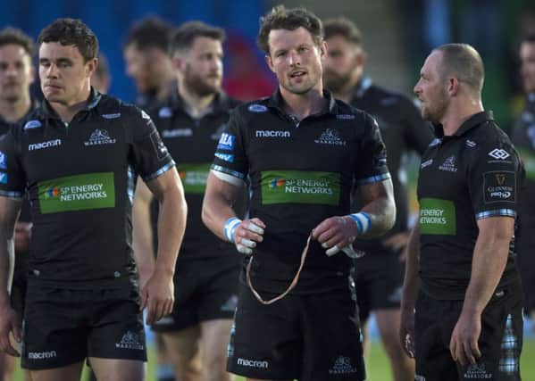 Peter Horne is dejected at full-time following Glasgows defeat by Scarlets. Picture: SNS/SRU
