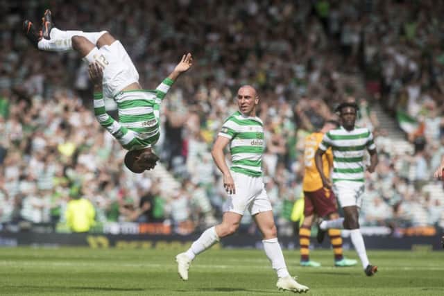 Head over heels: Olivier Ntcham celebrates his goal in acrobatic style. Photograph: John Devlin