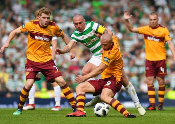 Celtic's Scott Brown competes with Motherwell's Curtis Main. Picture: SNS/Craig Foy