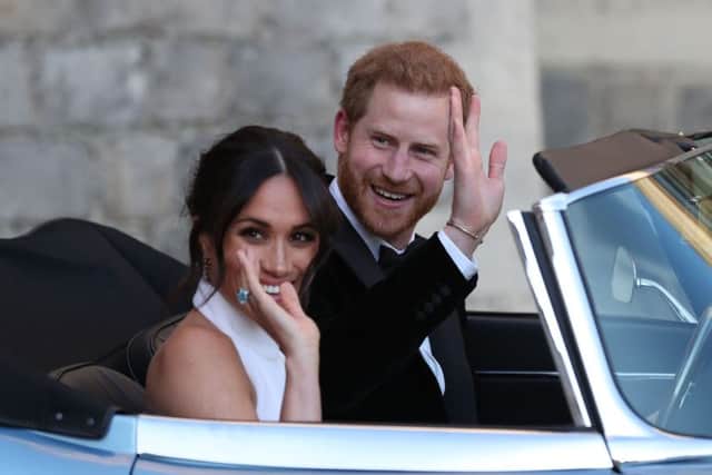 The newly married Duke and Duchess of Sussex, Meghan Markle and Prince Harry, leaving Windsor Castle to attend an evening reception at Frogmore House. Picture: Steve Parsons/PA Wire