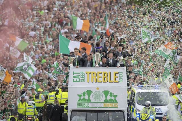 The Celtic open top bus on its way to Parkhead. Picture: SNS/Ross Parker