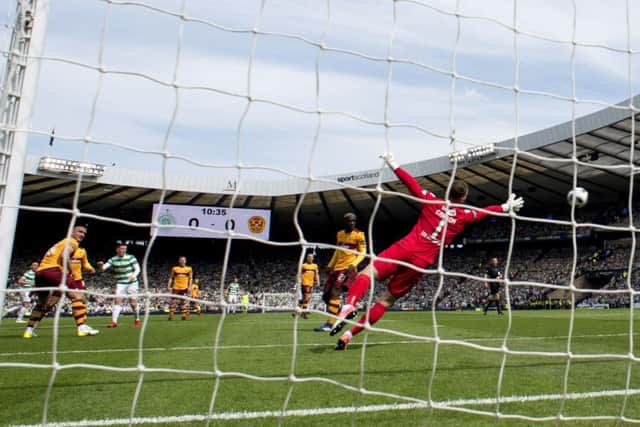 Callum McGregor, with his weaker right foot, fires the ball beyond Trevor Carson for Celtics opening goal. Picture: SNS.