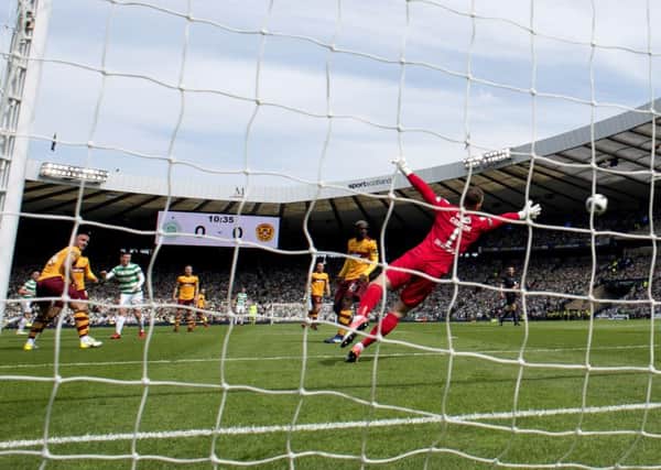 Callum McGregor, with his weaker right foot, fires the ball beyond Trevor Carson for Celtics opening goal. Picture: SNS.