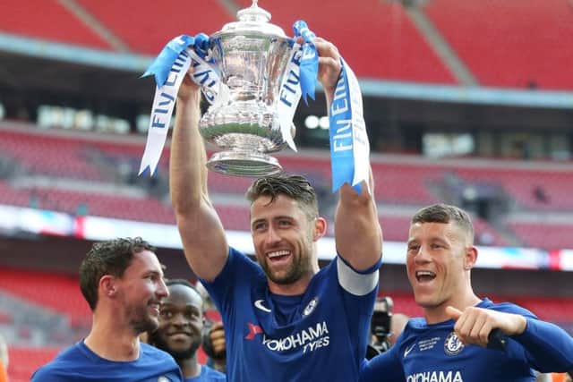 Chelsea captain Gary Cahill raises the FA Cup following their victory over Manchester United in Saturdays final. Picture: Getty.
