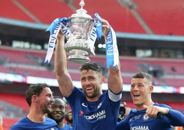 Chelsea captain Gary Cahill raises the FA Cup following their victory over Manchester United in Saturdays final. Picture: Getty.