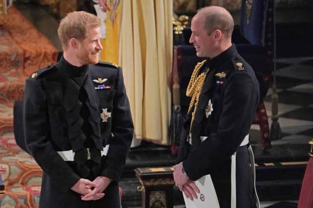 Britain's Prince Harry, Duke of Sussex (L) and Prince Harry's brother and best man Prince William, Duke of Cambridge wait in the chapel for Harry's bride to be to arrive. Picture: Getty Images