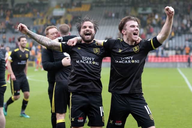 Livingston's Keaghan Jacobs (left) and Nicky Cadden celebrate promotion after victory against Patrick Thistle. Picture: PA.