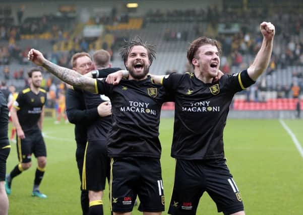 Livingston's Keaghan Jacobs (left) and Nicky Cadden celebrate promotion after victory against Patrick Thistle. Picture: PA.
