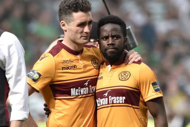 Motherwell skipper Carl McHugh, left, and Gael Bigirimana at full-time. Picture: SNS.