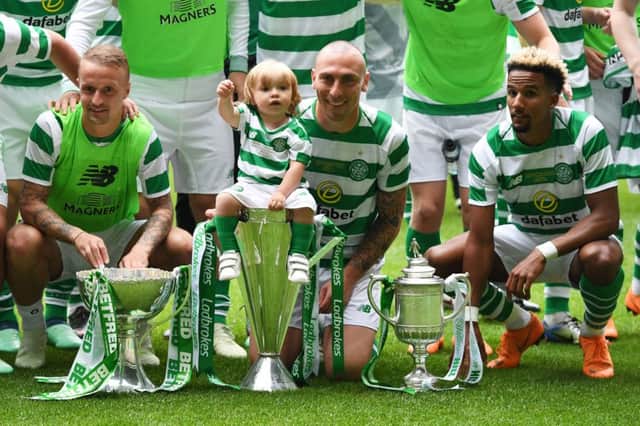 Scott Brown with the three domestic trophies Celtic won this season. Picture: SNS